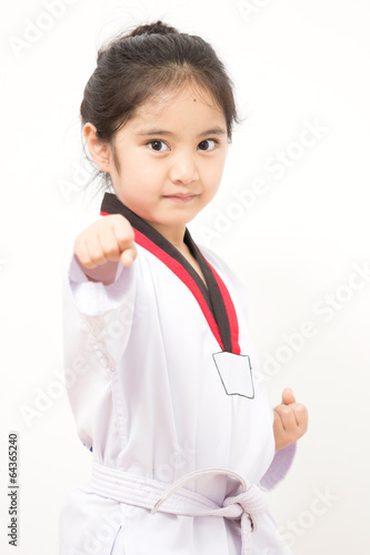 Leinwand Poster Little asian child in fighting action on isolated background