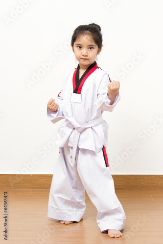 Foto Little asian child in fighting action