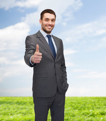 Poster - handsome buisnessman showing thumbs up