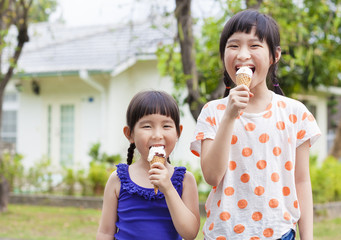 Wall Mural - Cute little Girls  Eating Ice Cream