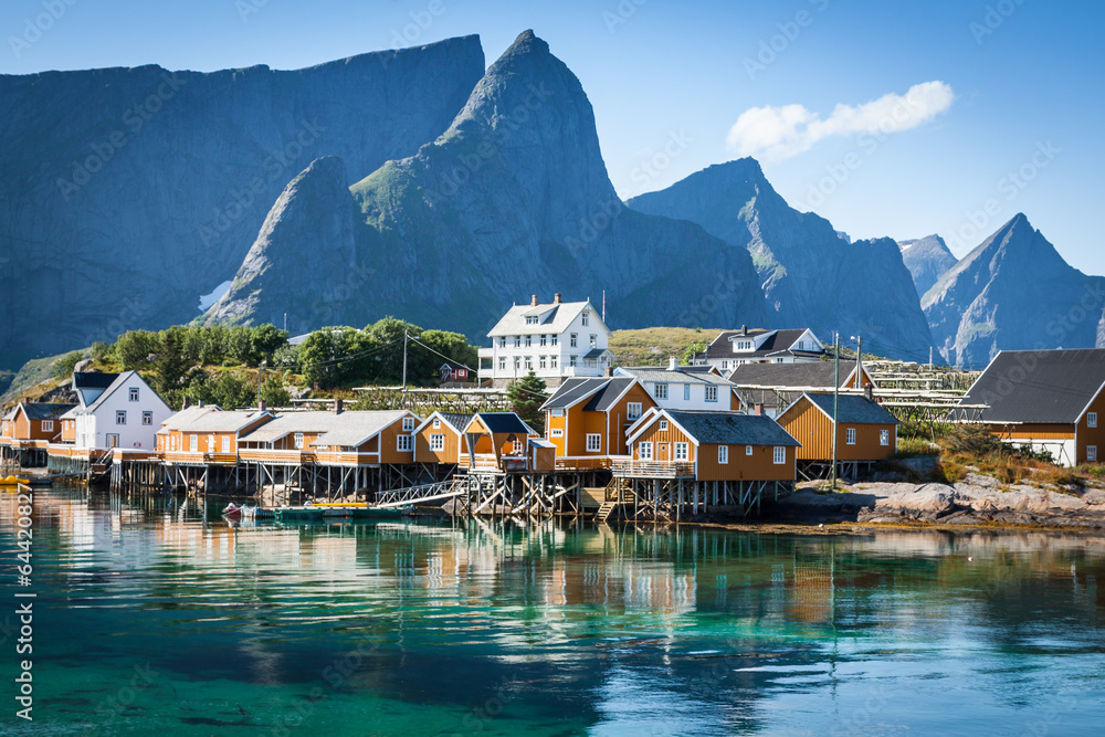 Typical Norwegian fishing village with traditional red rorbu hut - obrazy, fototapety, plakaty 