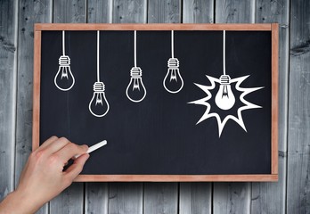 Poster - Composite image of hand drawing light bulbs with chalk