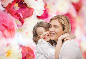 Canvas Print - happy mother and daughter hugging