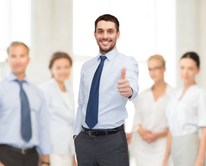 Canvas Print - handsome businessman with crossed arms