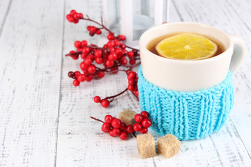 Fototapete - Cup of tea with lemon close up