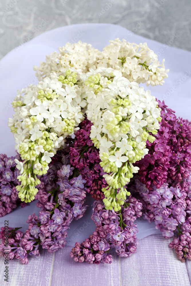 Beautiful lilac flowers on wooden table