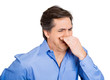 © pathdoc - Bad smell. Man pinching his nose, can't tolerate odor