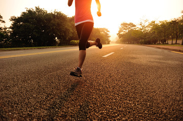 Poster - Runner athlete running on sunrise road