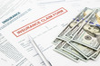 © vinnstock - insurance claim form and money