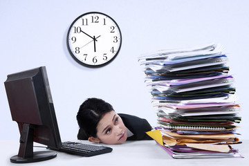 Businesswoman with stack of document