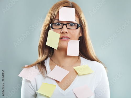 Fotografía Beautiful young woman covered with post it notes