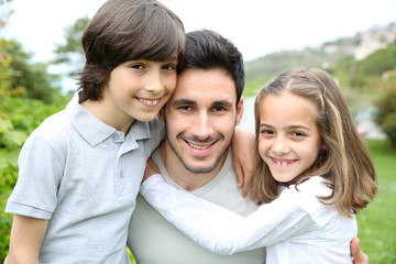 Wall Mural - Portrait of young man with 2 kids