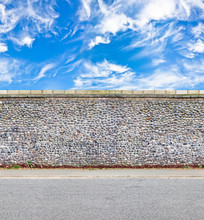 Stone Wall With Road And Skies Horizontal Seamless Image
