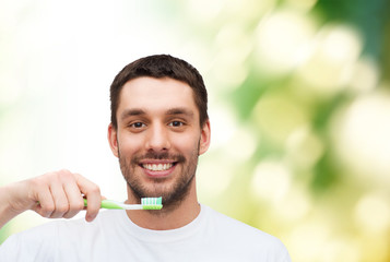 Poster - smiling young man with toothbrush