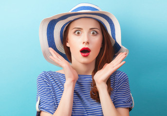 Sticker - Redhead girl in hat on blue background.