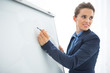 © Alliance - Closeup on business woman writing in flipchart