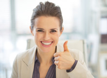 Portrait Of Happy Business Woman Showing Thumbs Up