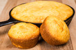 Cornbread muffins and cornbread pone in an iron skillet