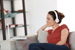 © goodluz - Woman with headphones chating on internet