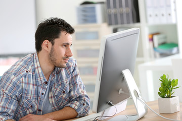 Wall Mural - Student in web-design working in office