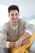 © goodluz - Portrait of young man relaxing at home