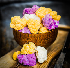 Colorful cauliflower on rustic background