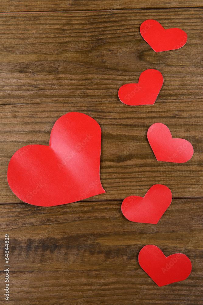 Paper hearts on wooden  background