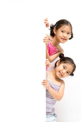 Wall Mural - Happy young Asian girl holding a blank white card.