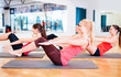 © Syda Productions - group of smiling women exercising in the gym