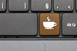 © Zerophoto - Coffee break. Brown hot key on computer keyboard.