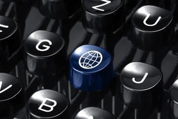 Wall Mural - World News. Blue hot key on an old typewriter