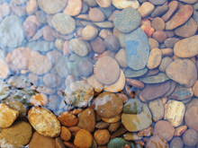 Abstract Background With Round Sea Stones