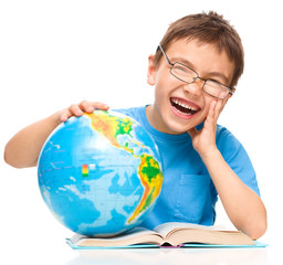 Wall Mural - Little boy is holding globe