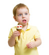 © Andrey Kuzmin - funny kid eating ice cream isolated on white