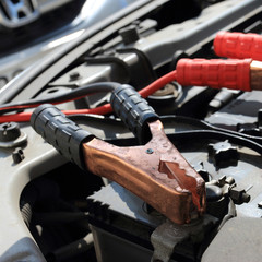 Charging battery car with electricity trough jumper cables