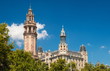 Fragment of old elegant building with towers in Barcelona