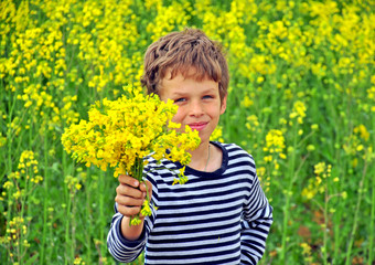 Boy with a bouquet of wildflowers