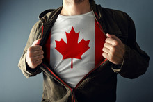 Man Stretching Jacket To Reveal Shirt With Canada Flag
