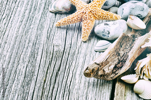 Naklejka na kafelki Marine background with pebbles and starfish