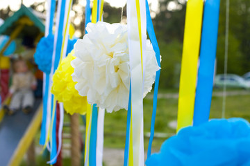 Stylish ornament for a holiday from tapes and paper pompons