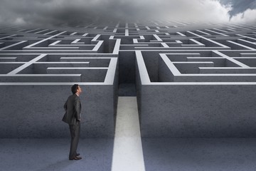 Aufkleber - Composite image of smiling businessman with hands on hips