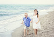 © Brocreative - Children running together along the beach