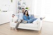 © jackfrog - cheerful couple relaxing in sofa at home