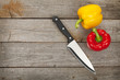 © karandaev - Colorful bell peppers and kitchen knife