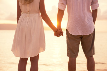 Couple on the beach sunset