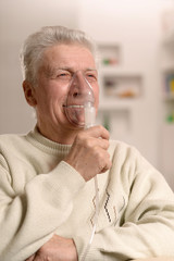 Poster - Elderly man making inhalation