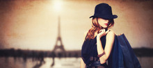 Redhead Women With Shopping Bags On Parisian Background.