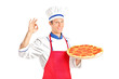 © Ljupco Smokovski - Male chef holding a pizza and gesturing with hand