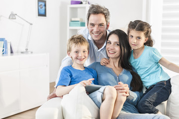 family playing together on a digital tablet