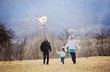 © Halfpoint - Happy family with kite